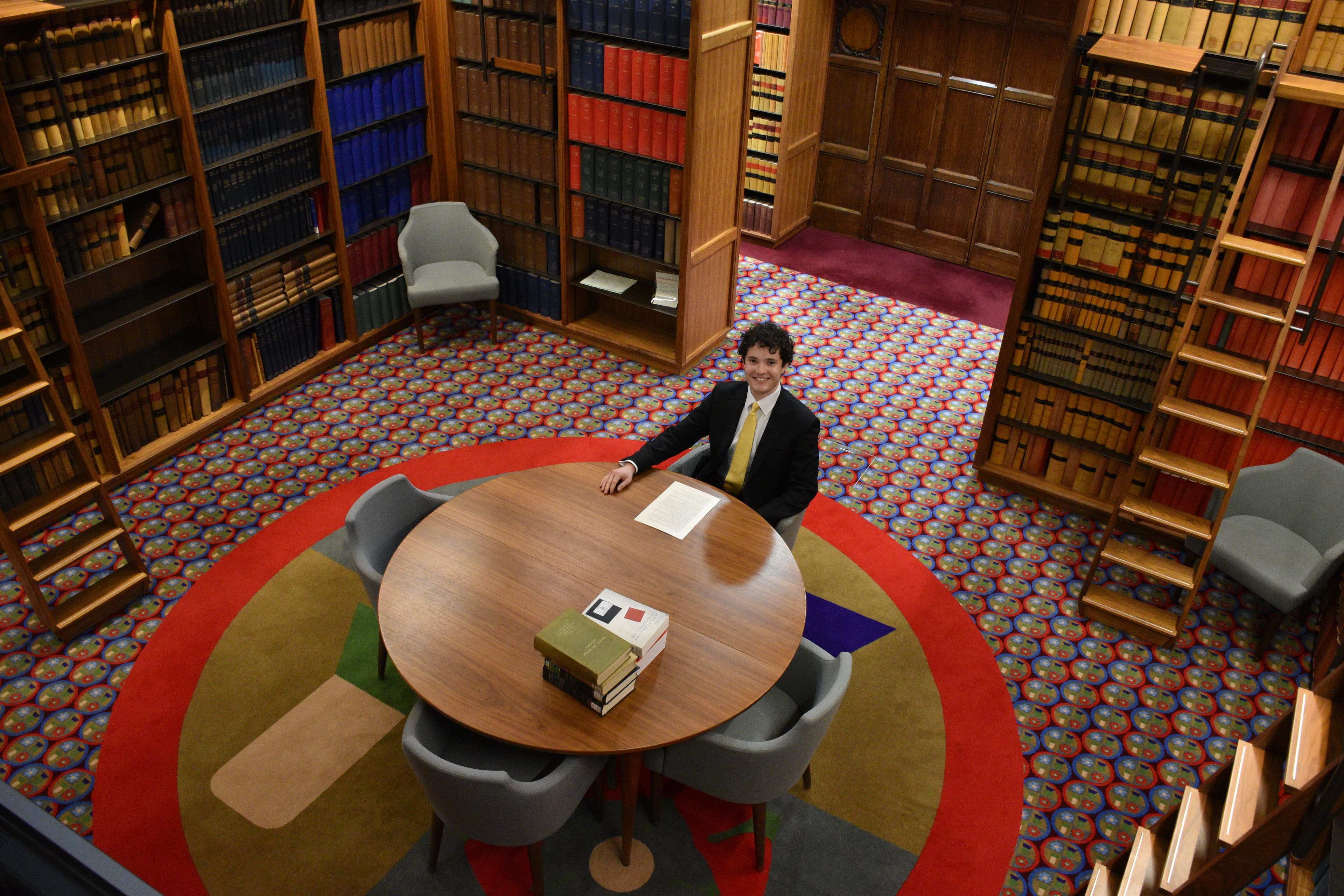 Competition winner Jude D'Alesio in the Supreme Court library.